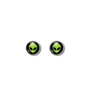 May include: A pair of silver stud earrings with black circular bases and green alien head designs.