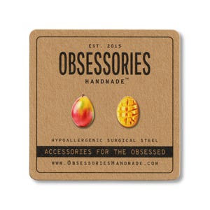 May include: A pair of mango-shaped earrings on a brown card. One earring is a whole mango, the other is diced. The card reads "OBSESSORIES HANDMADE" and "ACCESSORIES FOR THE OBSESSED".