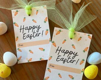 May include: Two white gift tags with a carrot pattern and the text "Happy Easter!" with a blank line for "From:". The tags are tied with green tulle ribbon.