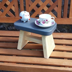 Handmade wooden step stool, milking stool, child's stool, chunky, rustic. Grey seat highlight.