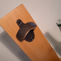 Handmade bottle opener from recycled pallet wood.