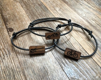 Bracelet with a wooden symbol placed on a leather strap