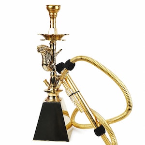 May include: A gold-colored hookah featuring a cobra-shaped stem, a black pyramid-shaped base, and a flexible gold-colored hose with black accents. The structure includes a metal bowl at the top and a decorative tray, all finished in a polished metallic gold.