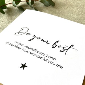 May include: A white card with black text that reads "Do your best make yourself proud and remember how wonderful you are". A small black star is below the text.