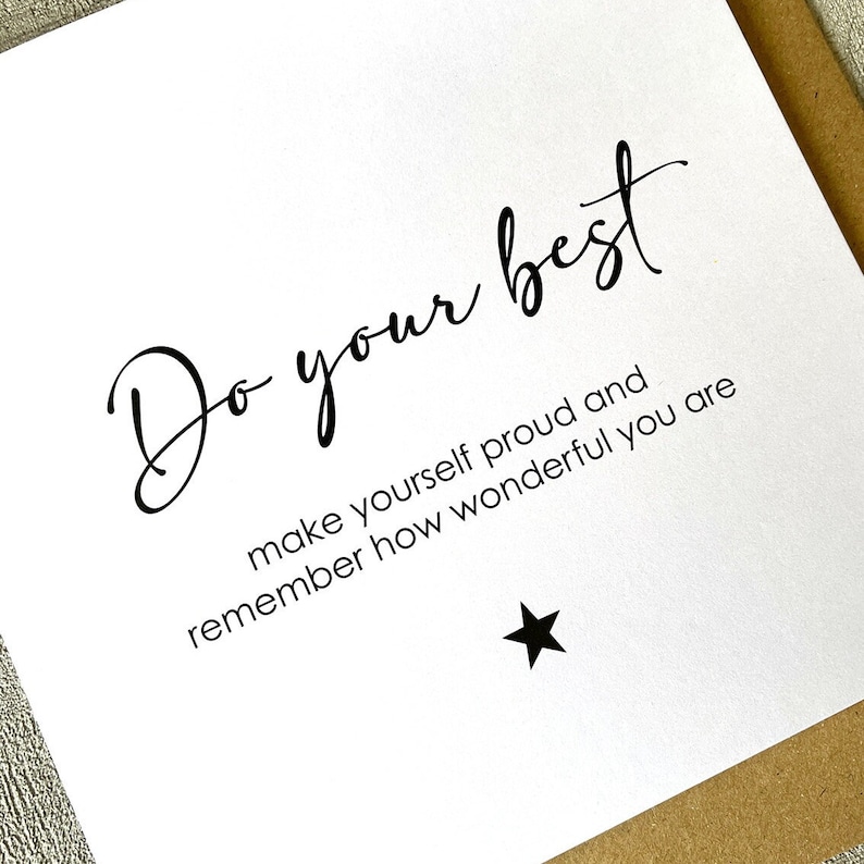 May include: White card with black text that reads "Do your best make yourself proud and remember how wonderful you are". A black star is at the bottom of the card.
