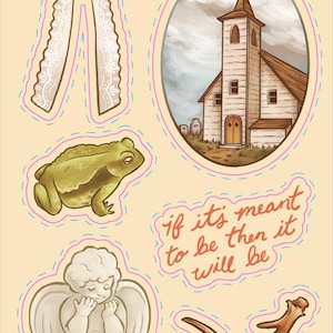 May include: A sticker sheet featuring a white lace bow, a church in an oval frame, a green toad, a cherub with wings, a brown antler, and the text "if it's meant to be then it will be". The sheet includes the text "Scar Rose Studio" and "2026".