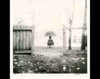 Under umbrella. Silver gelatin print from paper negative.