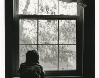 Boy at the window.Silver gelatin print