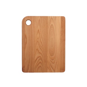 May include: A rectangular wooden cutting board with a light brown color and a grain pattern. The board has a small round hole in the top left corner.