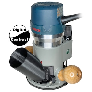 May include: A blue and gray Bosch router with a black dust collection attachment. The router has a black power cord and a black and white digital contrast logo.