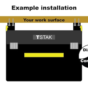May include: Black and yellow tool box with the text "TSTAK" and "Example installation". The tool box is hanging from a wooden surface. A circular graphic with the words "Digital Contrast" is on the right.
