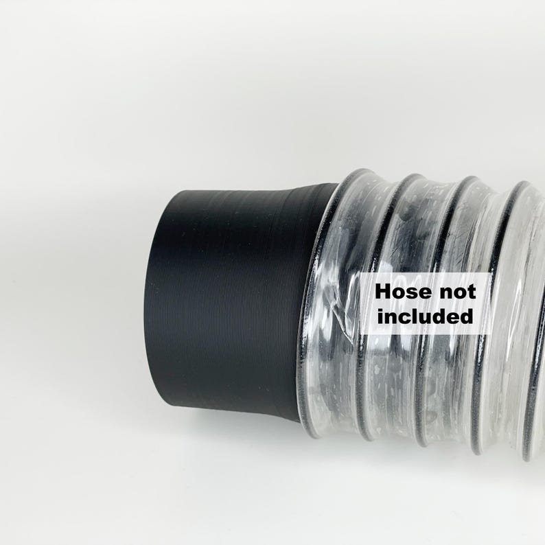 May include: Close-up of a black and clear flexible hose connector. The connector has a black rubber end and a clear plastic corrugated section. The text "Hose not included" is printed on the clear section.