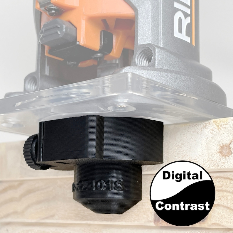 K&ouml;nnte beinhalten: Ein schwarzer Router-Bit aus Kunststoff mit einem schwarzen Knopf und einem wei&szlig;en Etikett mit der Aufschrift "Digital Contrast".