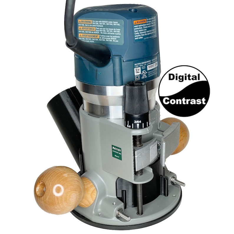 May include: A gray and blue Bosch router with a black dust collection port and two wooden handles. The router has a depth adjustment knob with a scale marked in 1/16 inches. The router is labeled "RA1101 2.25 HP 1800-25000 RPM".