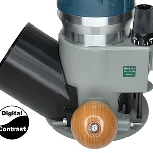 May include: A gray and black router base with a wooden knob and a black dust collection port. The router base has a label that reads "RA1161 2 610 927 569 Base 5".