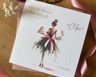 May include: A birthday card with a watercolor illustration of a woman in a black dress holding a cake and balloons. The card reads "Happy 18th Birthday to a beautiful daughter" and is personalized with the name "Chloe" and the date "21st May 2025".
