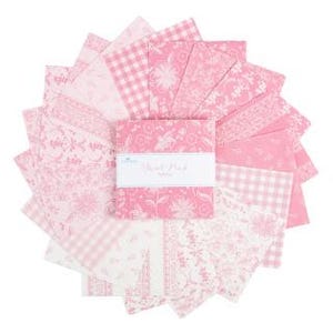 May include: A collection of pink and white fabric squares arranged in a circular pattern. The squares feature various floral, gingham, and patterned designs. A central stack of squares has a white label with the text "Flower Patch".