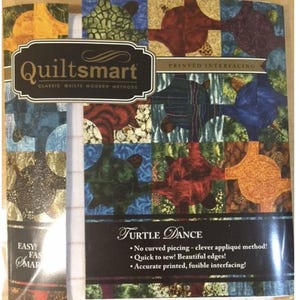 May include: A package of "Quiltsmart" printed interfacing for quilting. The design is called "Turtle Dance" and features a repeating pattern of colorful turtle shapes in shades of blue, green, red, and orange. The package includes text that says "Easy!" and "Fast!"