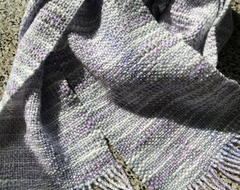 Handwoven mixed fibres scarf in greys,lilacs and white. Acrylic and cotton.Ready to ship.