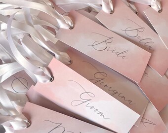 Personalised Pink Watercolour Place Cards, Silver Calligraphy Wedding Name Tags, Custom Flat Place Names with Silver Eyelets & Satin Ribbon