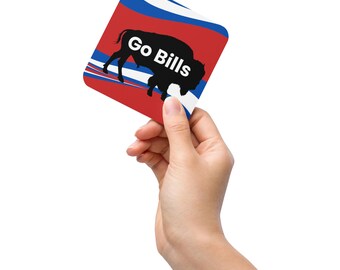 May include: A red, white and blue square coaster with a black silhouette of a buffalo and the text "Go Bills".