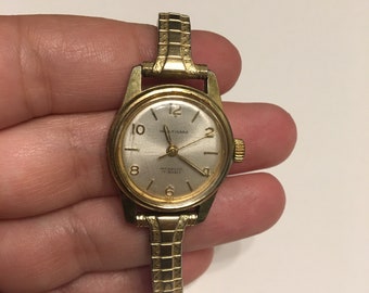 VINTAGE 1974 Timex Model 23 Women\'s 22mm Gold Tone Manual Wind Watch Vintage Timex Watch Women Gold Tone Stretch Band Date Manual  main image 2