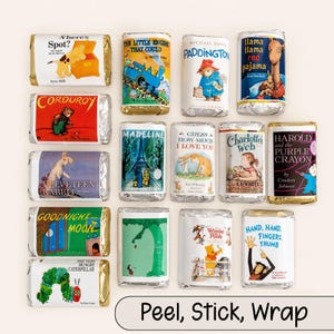 May include: An assortment of wrapped candy bars featuring classic children's book covers, including "Where's Spot?", "Corduroy", and "Goodnight Moon". The bars are arranged on a light background, with the words "Peel, Stick, Wrap" at the bottom.