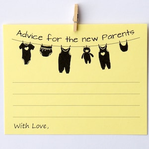 May include: A yellow sticky note with the text "Advice for the new Parents" and "With Love," printed on it. A clothesline graphic displays baby clothes and a teddy bear. The note is held by a wooden clothespin.
