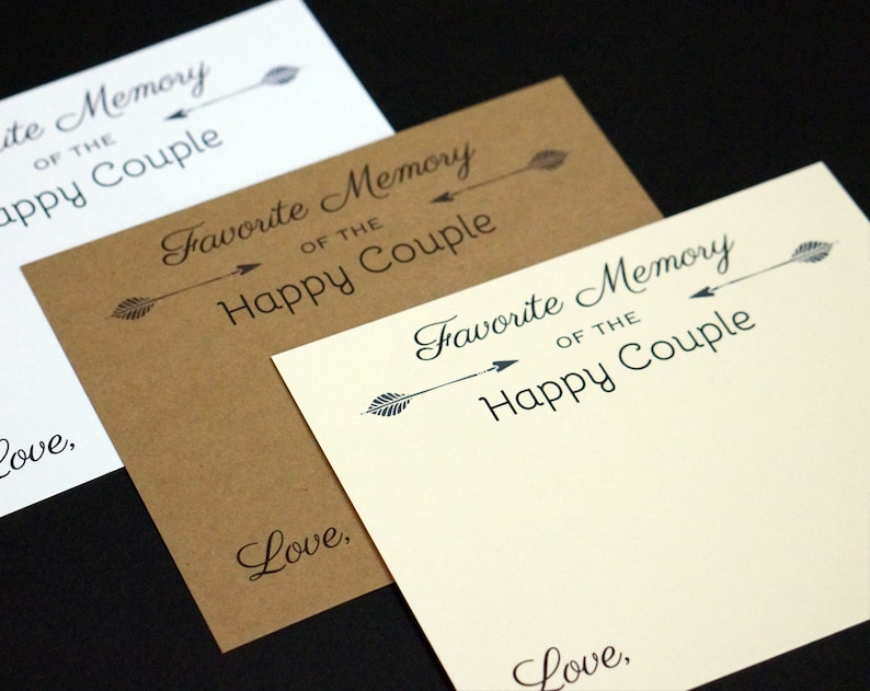 May include: Three cards in white, brown, and cream, each with the text "Favorite Memory of the Happy Couple" and "Love," in black script. An arrow design is above the text. The cards are arranged at an angle.