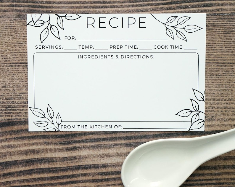 May include: A white recipe card with black text and leaf illustrations. The card includes sections for servings, temperature, prep time, cook time, ingredients, and directions. The text "RECIPE" is at the top, and "FROM THE KITCHEN OF:" is at the bottom.
