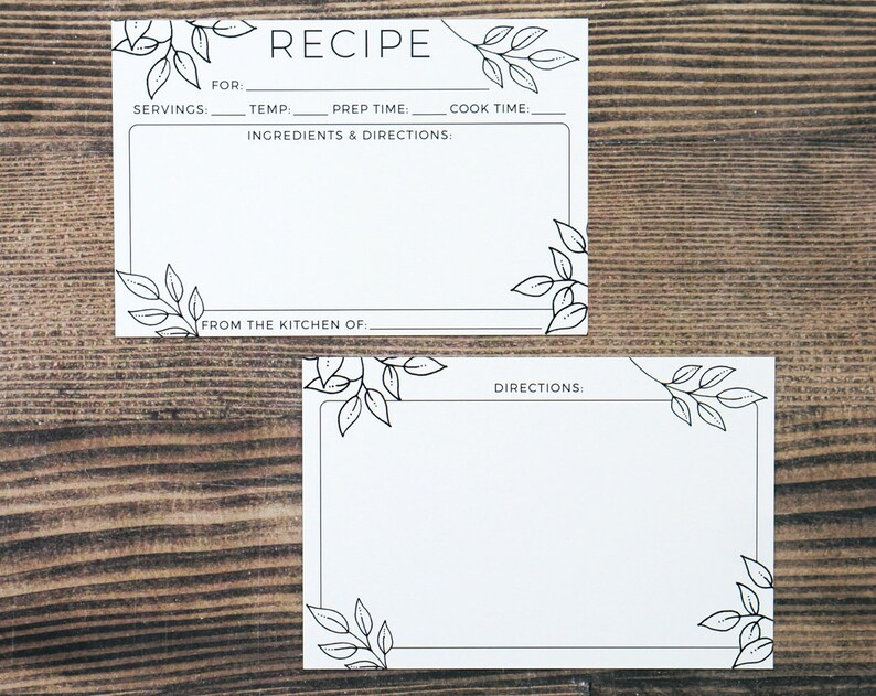 May include: Two white recipe cards with black leaf corner designs. The top card reads "RECIPE" and includes fields for servings, temperature, prep time, and cook time. The bottom card is for directions. Both cards have a blank space for writing.