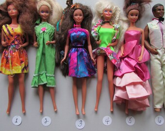 black ken and barbie dolls