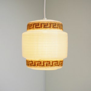 White Rotaflex plastic pendant with gold colored fabric - vintage lighting from Heifetz, 1950s
