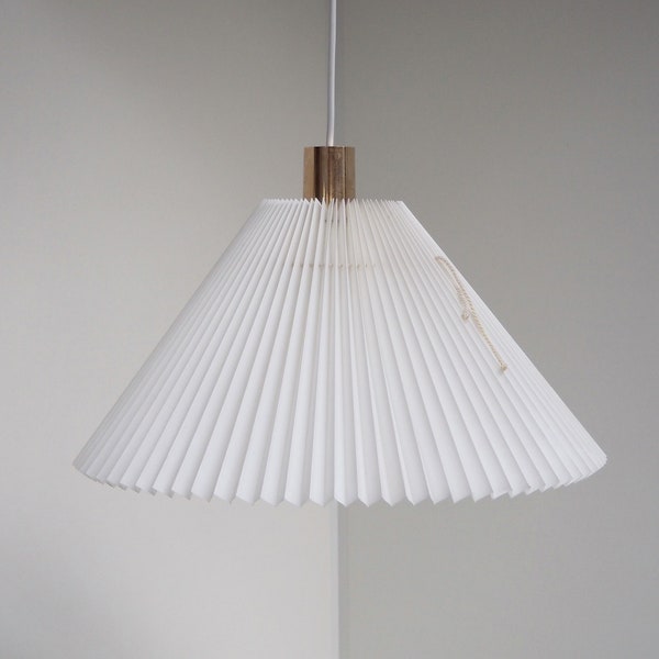 White pleated pendant with gold top made by Caprani Light - Danish lighting design from the 1970s - 1980s