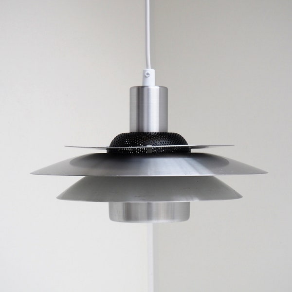 Silver colored pendant with black details from Top Lamper - Danish vintage design from the 1970s