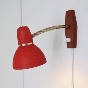 Red sconces with teak base and brass details - Danish design from the 1960s
