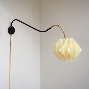 Swing sconce in brass & black metal together with a Butterfly shade - Danish design lighting from the 1960s