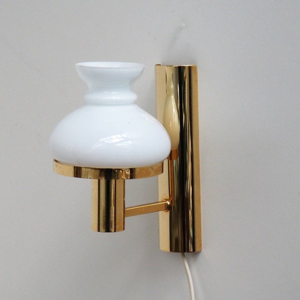 Gold colored wall light with white glass shade - Danish vintage design from the 1970s