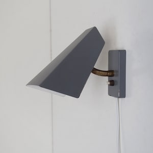 Lovely gray wall lamp from the German company Raiss made during the 1960s