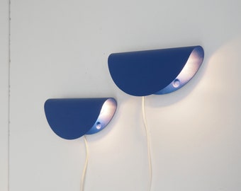 Pair of bright blue minimalist sconces made by Danish Nordlux during the 1980s