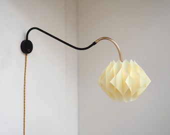 Swing sconce in brass & black metal together with a Butterfly shade - Danish design lighting from the 1960s