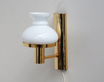 Gold colored wall light with white glass shade - Danish vintage design from the 1970s