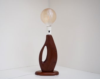 Exquisite vintage teak table lamp with a sculptural form—Danish design from the 1960s.