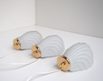 White shell glass sconce with gold details, vintage design from the 1980s