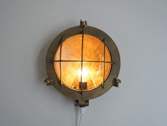 Vintage maritime wall lamp made in heavy solid brass with a thick glass shade