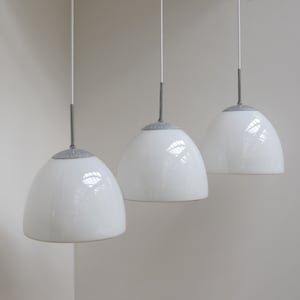 Set of 3 Delta Klokke pendants made in white opal glass -  Danish design from Louis Poulsen made during the 1960s