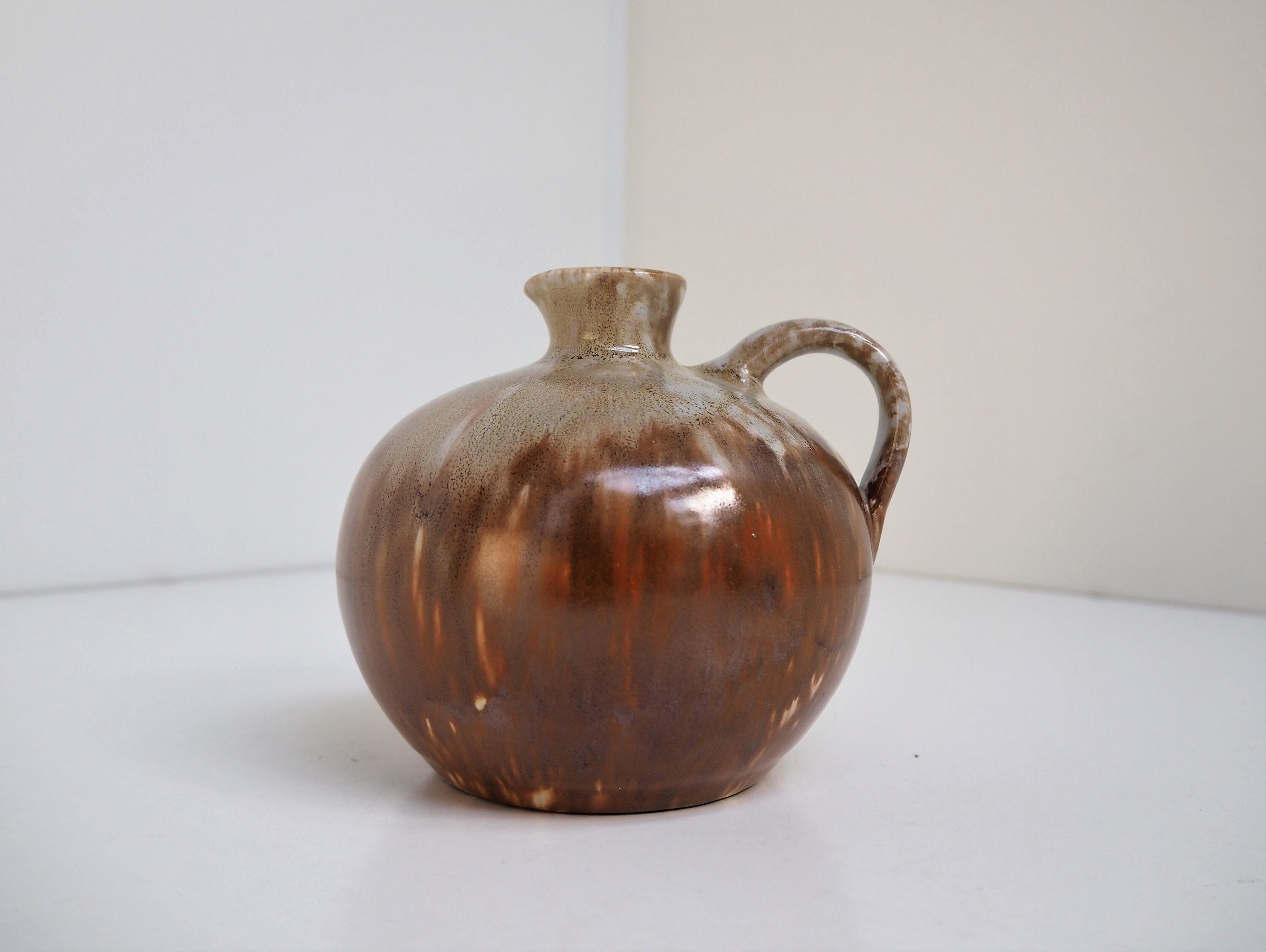 Little organic shaped ceramic vase / jug with beige and brown glaze made Christian Jensen, Danish design from the 1950s