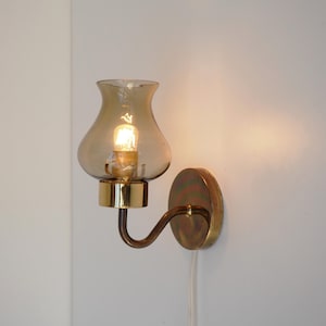 Nice brass sconce with decorative glass shade, vintage design from the 1960s