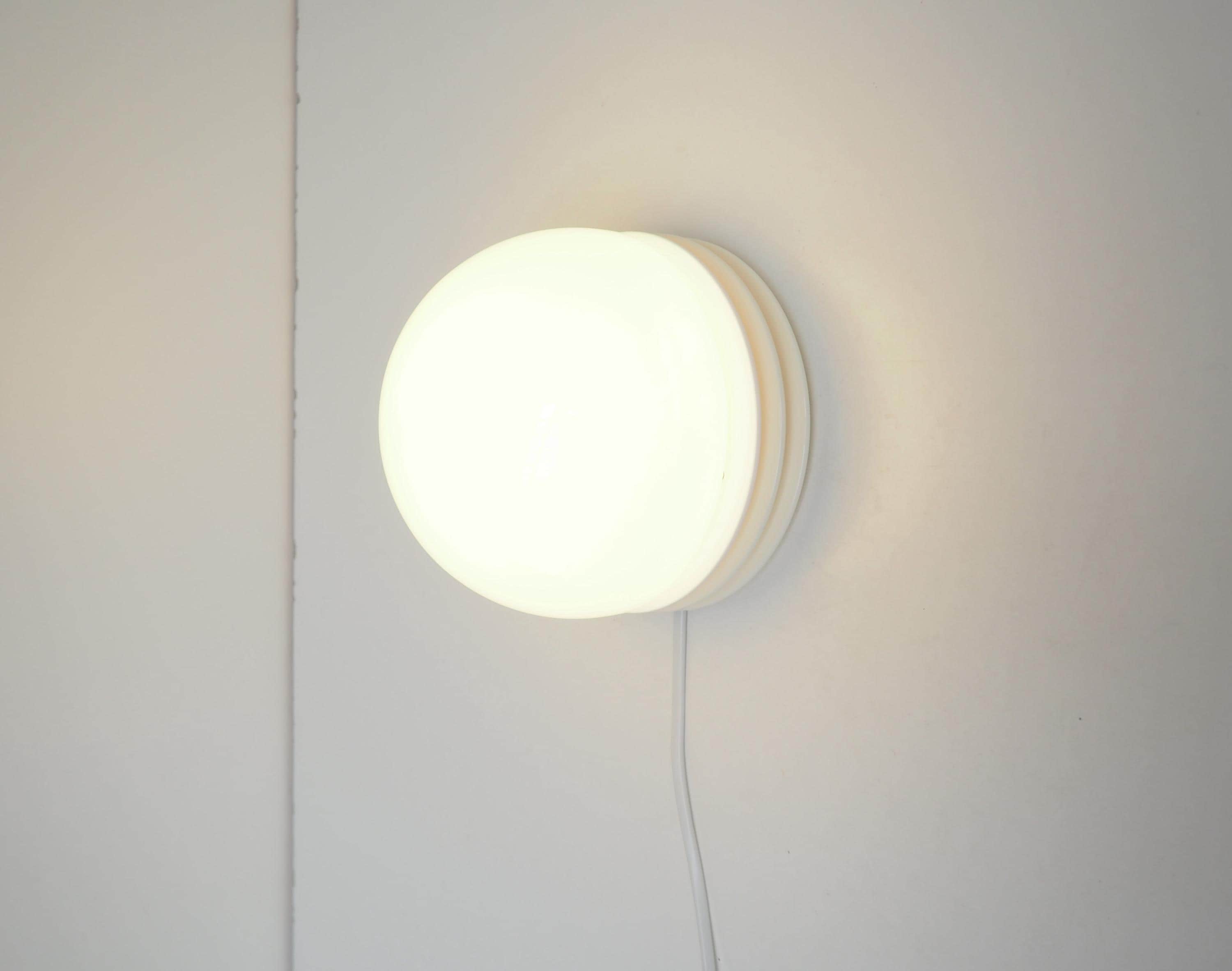 White glass and plastic wall lamp / plafond made by Nordlux, Danish vintage design from the 1970s - 1980s