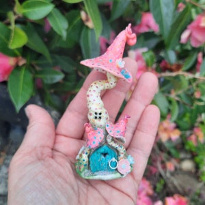 Pretty pink fairy house, with twisty toadstools and miniature flowers, handmade and painted